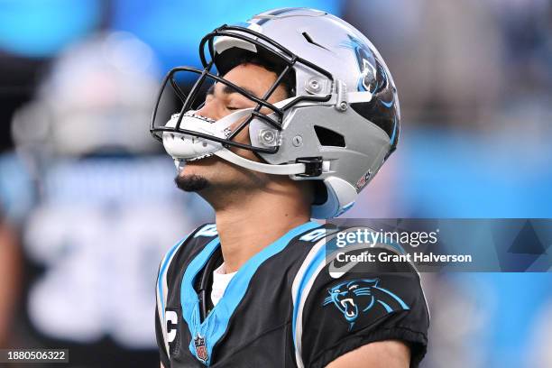 Bryce Young of the Carolina Panthers reacts to running out of time to make a play before the end of the game against the Green Bay Packers at Bank of...