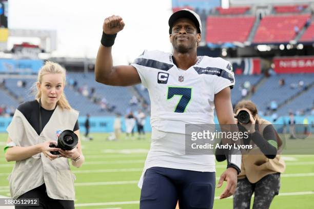 Geno Smith of the Seattle Seahawks walks off the field after a win over the Tennessee Titans at Nissan Stadium on December 24, 2023 in Nashville,...
