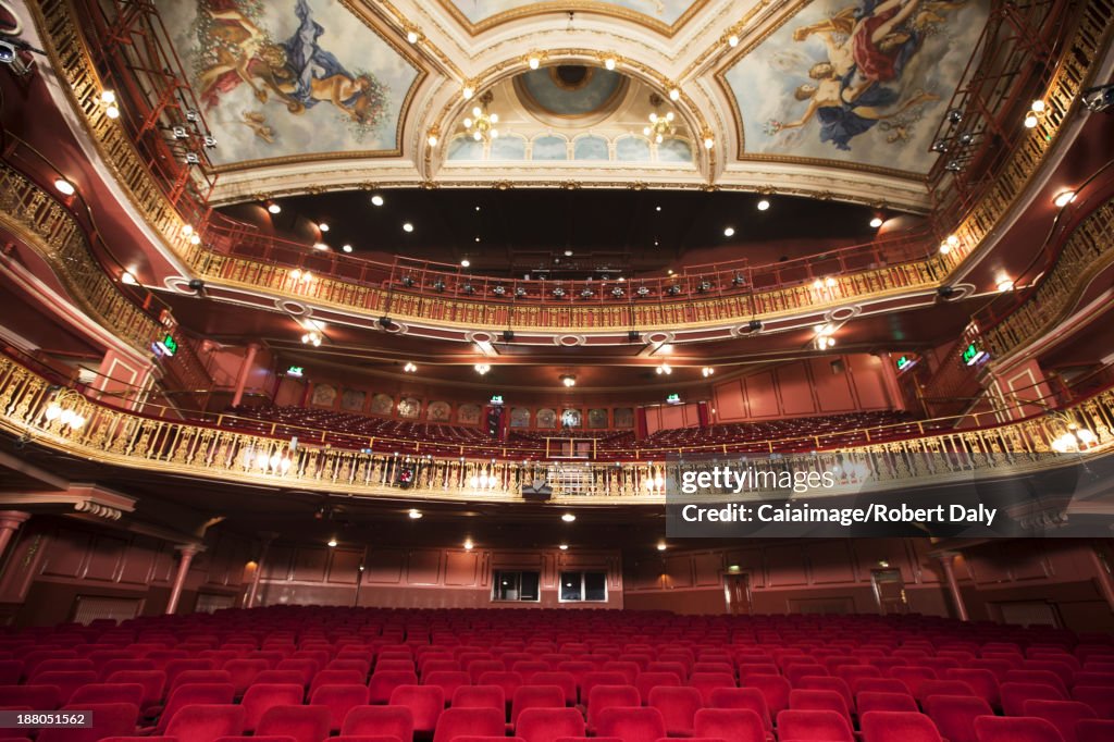 Balcony, seats and ornate ceiling in theater auditorium