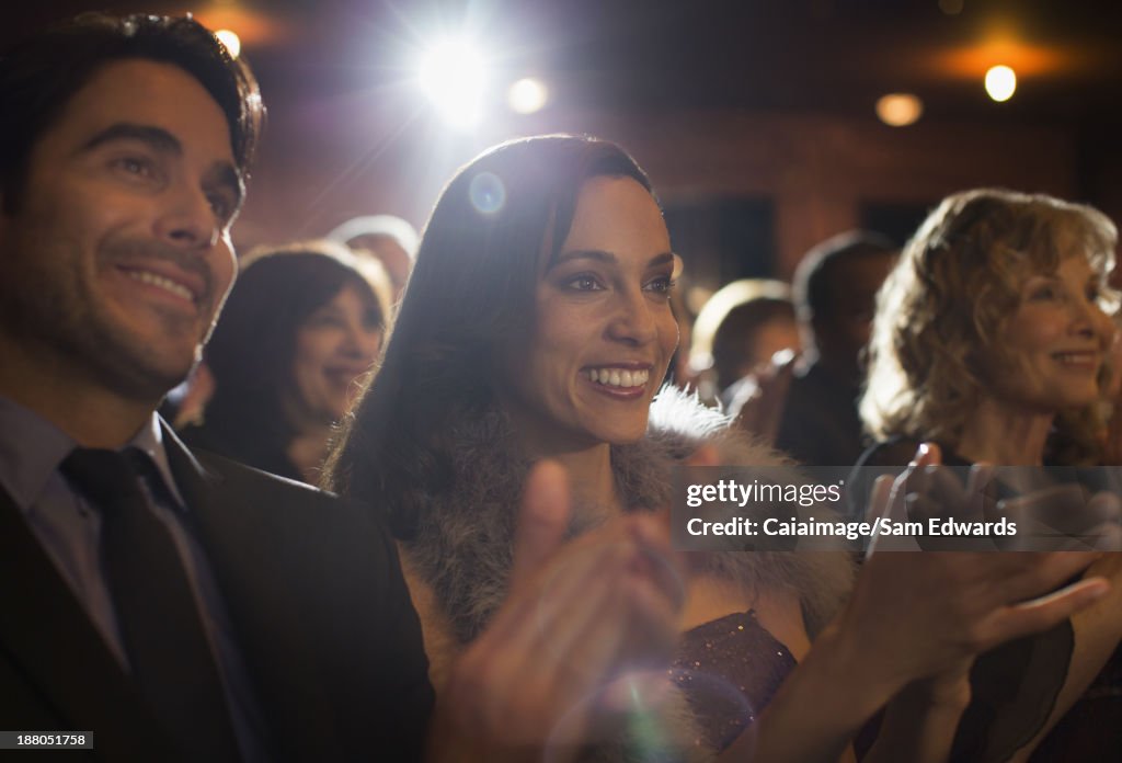 Close up of clapping theater audience