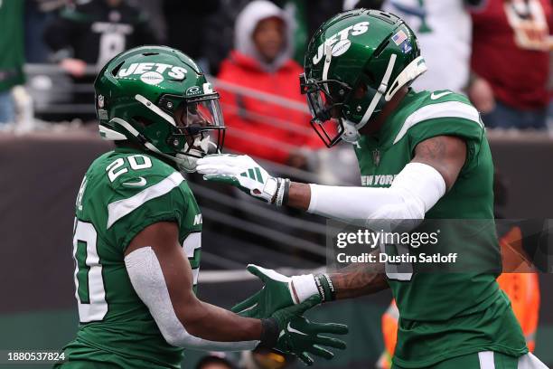 Breece Hall of the New York Jets celebrates a touchdown during the first half of a game against the Washington Commanders at MetLife Stadium on...