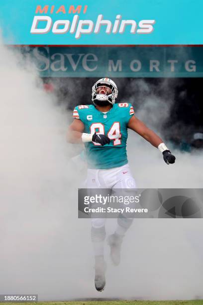 Christian Wilkins of the Miami Dolphins takes the field during player introductions prior to the game against the Dallas Cowboys at Hard Rock Stadium...