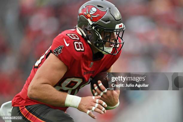 Cade Otton of the Tampa Bay Buccaneers catches a pass against the Jacksonville Jaguars during the second quarter at Raymond James Stadium on December...