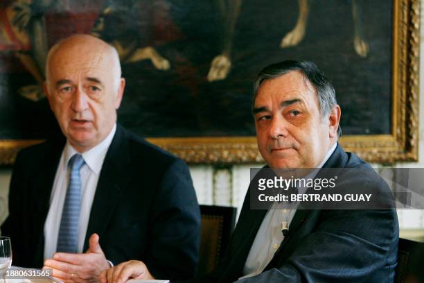French oil company Maurel and Prom chairman of the managing board Jean-François Hénin talks as Managing Director Roman Gozalo listens during a press...