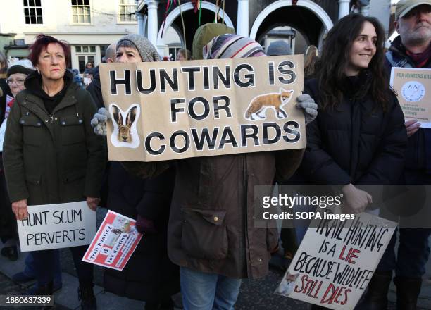 Protesters hold placards criticising the hunt and the hunt supporters during the demonstration. Action Against Animal Cruelty, protest was held in...