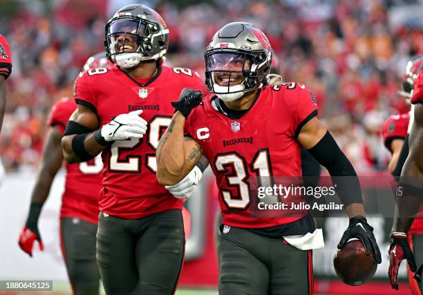 Antoine Winfield Jr. #31 of the Tampa Bay Buccaneers celebrates an interception against the Jacksonville Jaguars during the second quarter at Raymond...