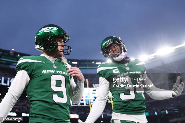 Greg Zuerlein of the New York Jets and Justin Hardee of the New York Jets look on after a game against the Washington Commanders at MetLife Stadium...