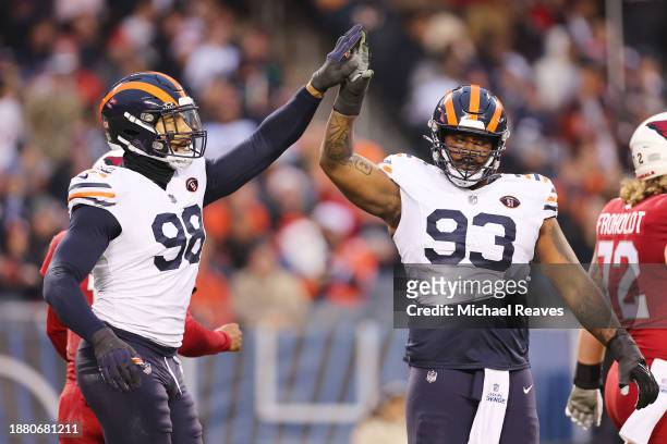 Montez Sweat and Justin Jones of the Chicago Bears celebrate a block during the second quarter against the Arizona Cardinals at Soldier Field on...