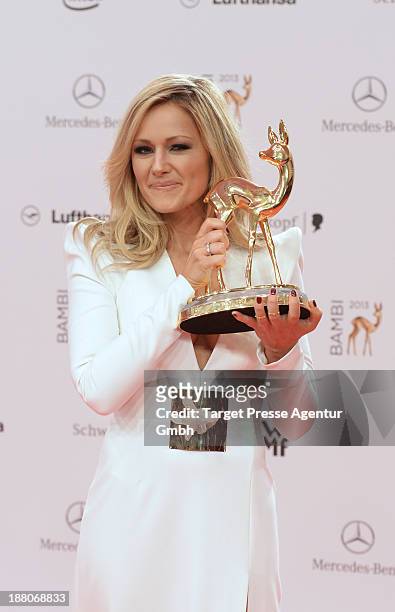 Helene Fischer poses with the Bambi for best music national at Stage Theater on November 14, 2013 in Berlin, Germany.