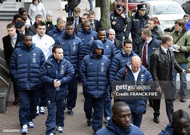 France's national football team players walk in the streets of Kiev, on November 15 hours before the World Cup 2014 first leg qualifying play-off...