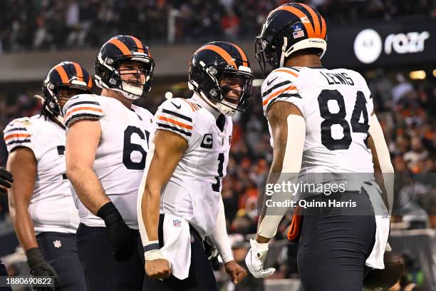 Justin Fields of the Chicago Bears celebrates after Marcedes Lewis of the Chicago Bears scores a touchdown during the second quarter against the...