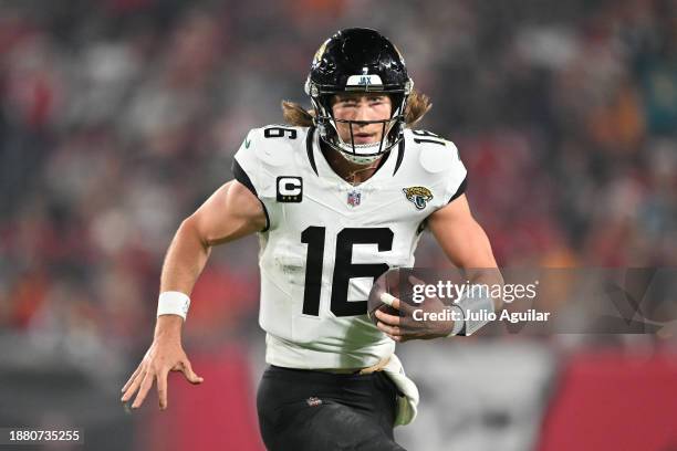 Trevor Lawrence of the Jacksonville Jaguars runs the ball during the third quarter against the Tampa Bay Buccaneers at Raymond James Stadium on...