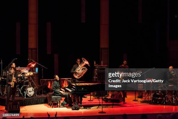 American Jazz musician Jonathan Batiste plays piano as he leads his band Stay Human during a Joyce and George Wein Foundation series 'The Shape of...