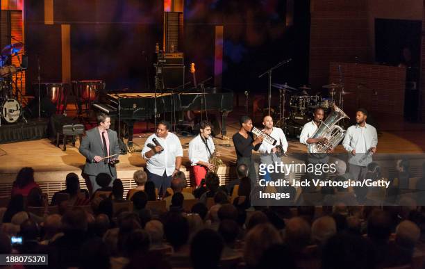 American Jazz musician Jonathan Batiste plays melodica as he leads his band Stay Human during a Joyce and George Wein Foundation series 'The Shape of...