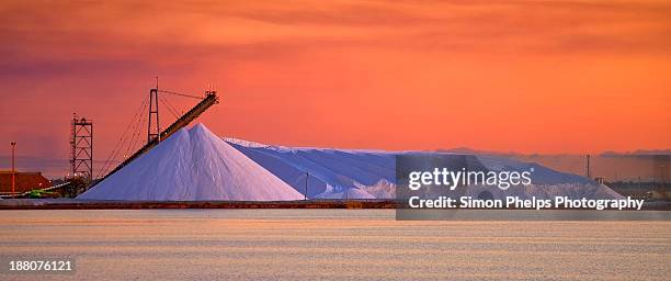 salt pile at sunset - cloud sales fotografías e imágenes de stock