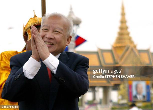 Cambodia's revered monarch Norodom Sihanouk greets well-wishers and Khmers during a royal reception, 06 November 2002 in front of Phnom Penh's Royal...