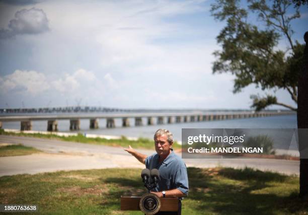 President George W. Bush gestures towards newly rebuilt bridges as he speaks on Mississippi rebuilding efforts 29 August 2007 at the Our Lady of the...