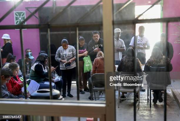 Volunteers assist migrants during an Al Otro Lado training session in Tijuana, Mexico, on Tuesday, Nov. 28 2023. President Biden has argued that he...