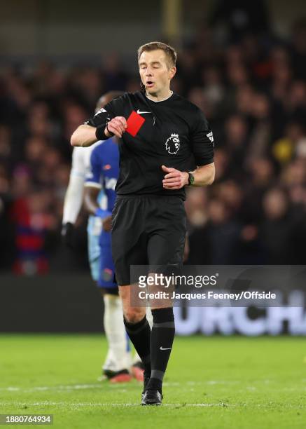 Match referee Michael Salisbury accidentally shows a red card instead of a yellow during the Premier League match between Chelsea FC and Crystal...