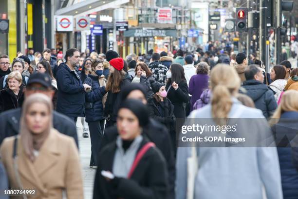 Shoppers walk on London's Oxford Street as Boxing Day sales begin.