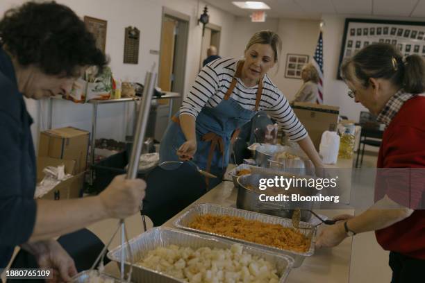 Volunteers prepare Thanksgiving meals to distribute to seniors and families in need at the Greenwich Fire Department-Byram Station in Greenwich,...