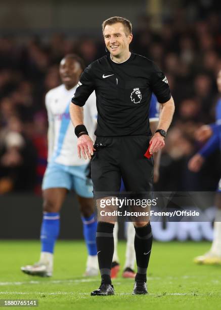 Match referee Michael Salisbury accidentally shows a red card instead of a yellow during the Premier League match between Chelsea FC and Crystal...