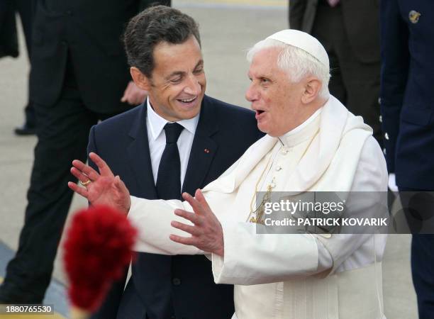 Pope Benedict XVI is welcomed by French President Nicolas Sarkozy upon his arrival at Orly airport, south of Paris, on September 12, 2008 for his...