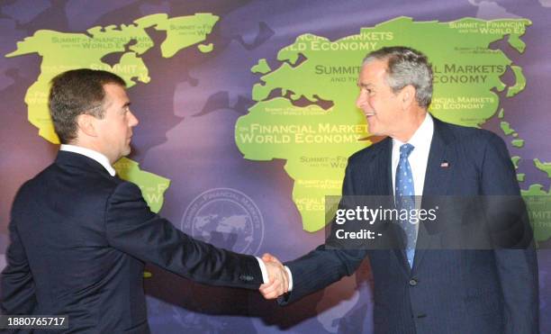 President George W. Bush greets Russian counterpart Dmitry Medvedev at the G20 Summit at the National Building Museum on November 15, 2008 in...