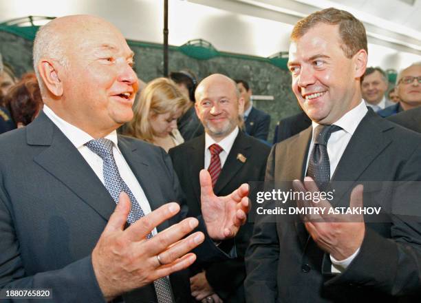 Russian President Dmitry Medvedev chats with Moscow Mayor Yury Luzhkov as they visit a new metro station on September 7, 2008 in Moscow. The defence...