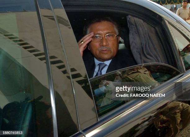 Pakistan President Pervez Musharraf responds to people gathered after the farewell ceremony on his departure the presidency in Islamabad on August...