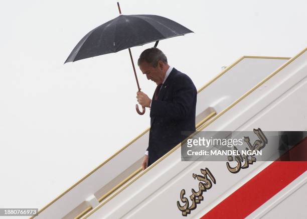 President George W. Bush steps off Air Force One 13 January 2008 upon arrival at Abu Dhabi International Airport, in Abu Dhabi. Bush arrived today in...