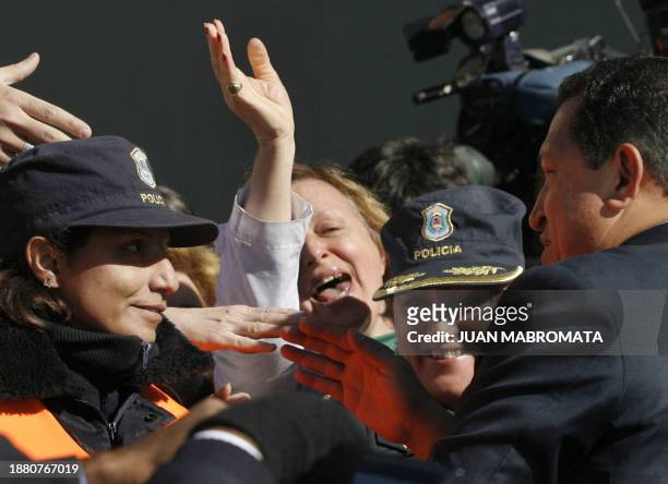 Venezuela's President Hugo Chavez is cheered by his supporters during a visit to the National Institute of Industrial Technology , in Buenos Aires, 7...