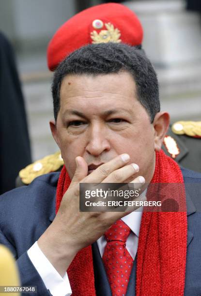 Venezuelan president Hugo Chavez addresses the press as he leaves the Elysee Palace after a lunch with his French counterpart Nicolas Sarkozy, 20...