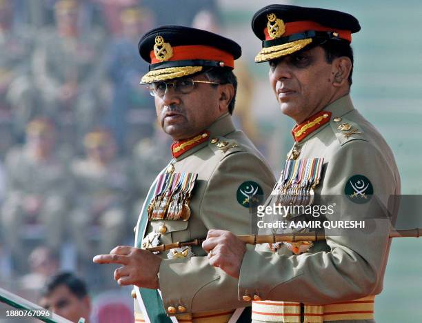 Pakistani newly appointed army chief General Ashfaq Kiyani and President Pervez Musharraf stand after the change of command ceremony in Rawalpindi,...