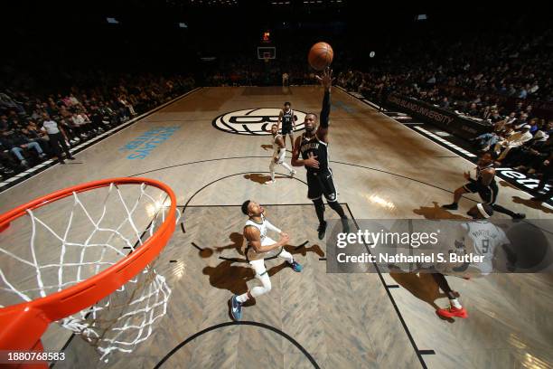 Harry Giles III of the Brooklyn Nets drives to the basket during the game against the Milwaukee Bucks on December 27, 2023 at Barclays Center in...