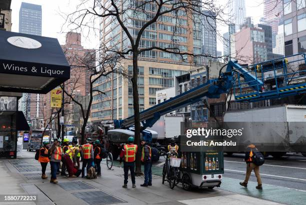 Workers carry out work due to the asbestos concerns from steam pipe leak in midtown Manhattan of New York, United States on December 27, 2023. Parts...