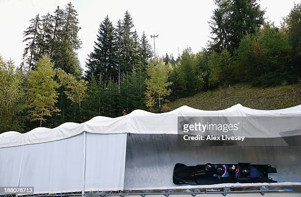 The crew of GBR2, Lamin Deen, John Baines, Andy Matthews and Toby Olubi of the Great Britain bobsleigh team take a bend during a training session at...