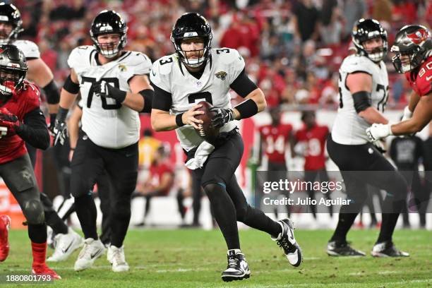 Beathard of the Jacksonville Jaguars scrambles with the ball against the Tampa Bay Buccaneers during the fourth quarter at Raymond James Stadium on...