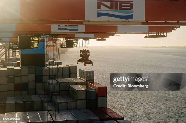 Gantry crane collects a shipping container from the deck of the Maersk Mc-Kinney Moeller Triple-E Class container ship, operated by A.P....