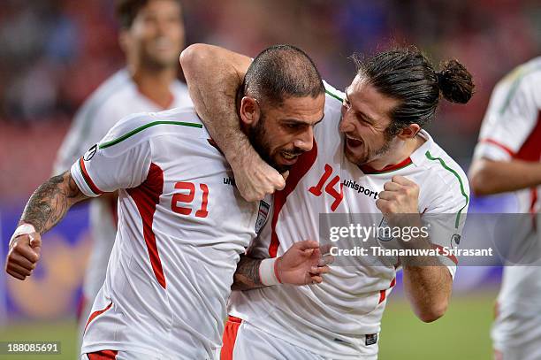 Ashkan Dejagah of Iran celebrate his goal with team mate Anderanik Teymourian during their 2015 Asian Cup group B qualifying football match at...