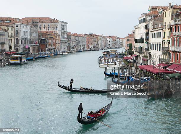 Two gondola manouvers along an unusually empty Grand Canal around the Rialto area during the third day of strike by the transporters on November 15,...