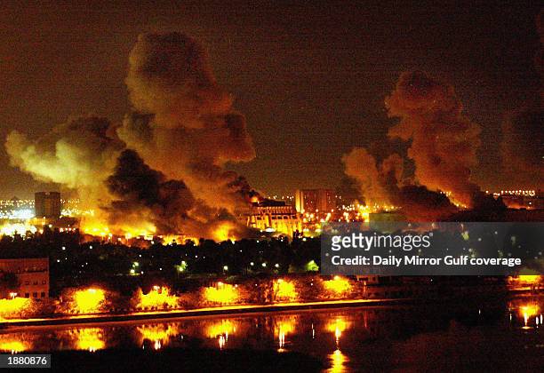 Fires burn in and around Saddam Hussein's Council of Ministers during the first wave of attacks in the "shock and awe" phase of "Operation Iraqi...