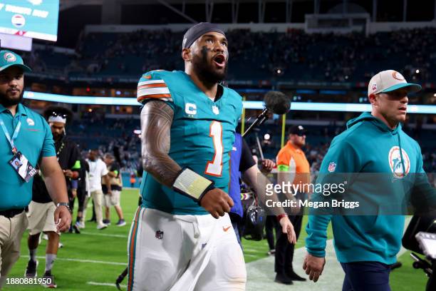 Tua Tagovailoa of the Miami Dolphins walks off the field after defeating the Dallas Cowboys at Hard Rock Stadium on December 24, 2023 in Miami...