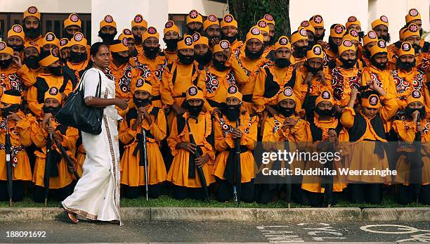 Sri Lankan school students wait to perform traditional dance out side the Nelum Pokuna Mahinda Rajapakse Theatre during the CHOGM oppening ceremony...