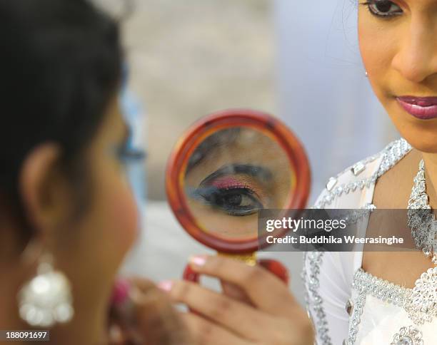 Sri Lankan school students prepare to perform traditional dance out side the Nelum Pokuna Mahinda Rajapakse Theatre during the CHOGM oppening...