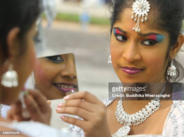 Sri Lankan school students prepare to perform traditional dance out side the Nelum Pokuna Mahinda Rajapakse Theatre during the CHOGM oppening...