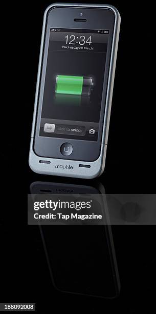 An Apple iPhone 5 with a Mophie Juice Pack Helium photographed on a black background, taken on March 7, 2013.