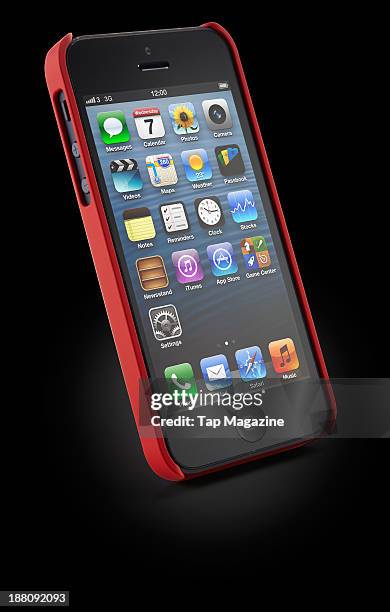 An Apple iPhone 5 with a Pong Classic Soft Touch Case case photographed on a black background, taken on March 7, 2013.