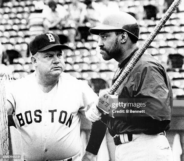 Manager Don Zimmer speaks with George Scott of the Boston Red Sox during batting practice before the game against the Texas Rangers on May 30, 1979...