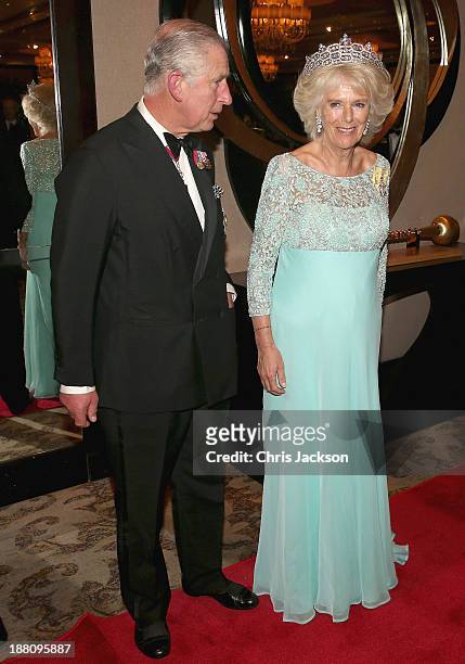 Camilla, Duchess of Cornwall and Prince Charles, Prince of Wales wait for guests in a line-up as they attend the CHOGM Dinner at the Cinnamon...